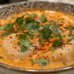 A Steaming Bowl of Red Curry Dumpling Soup